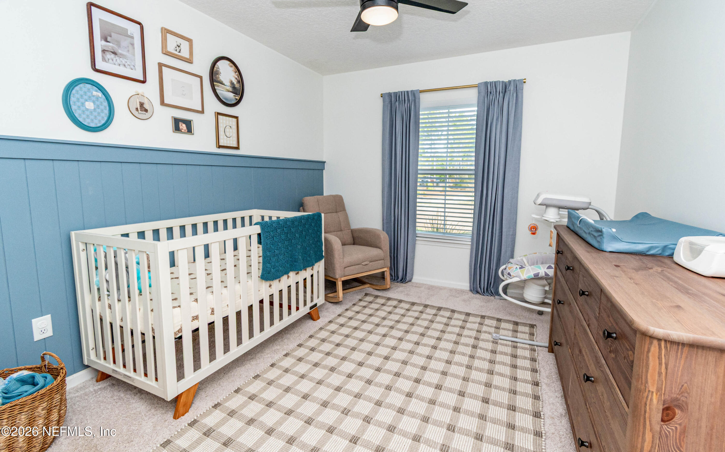 10800 Plummer Road Jacksonville, FL 32219 - Photo 38 of 67 a bedroom with a baby bed and a window