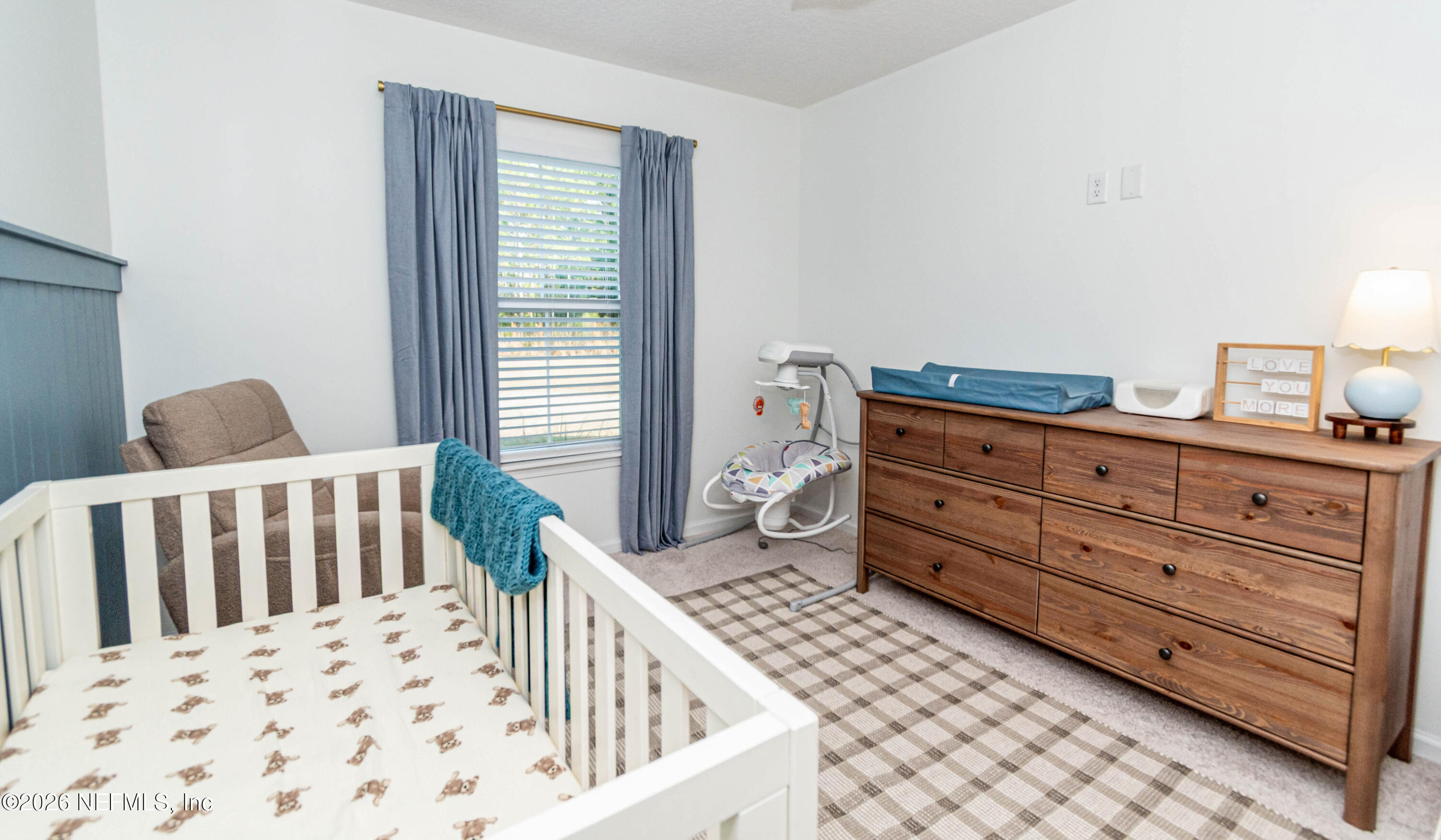 10800 Plummer Road Jacksonville, FL 32219 - Photo 39 of 67 a bedroom with a bed and a window