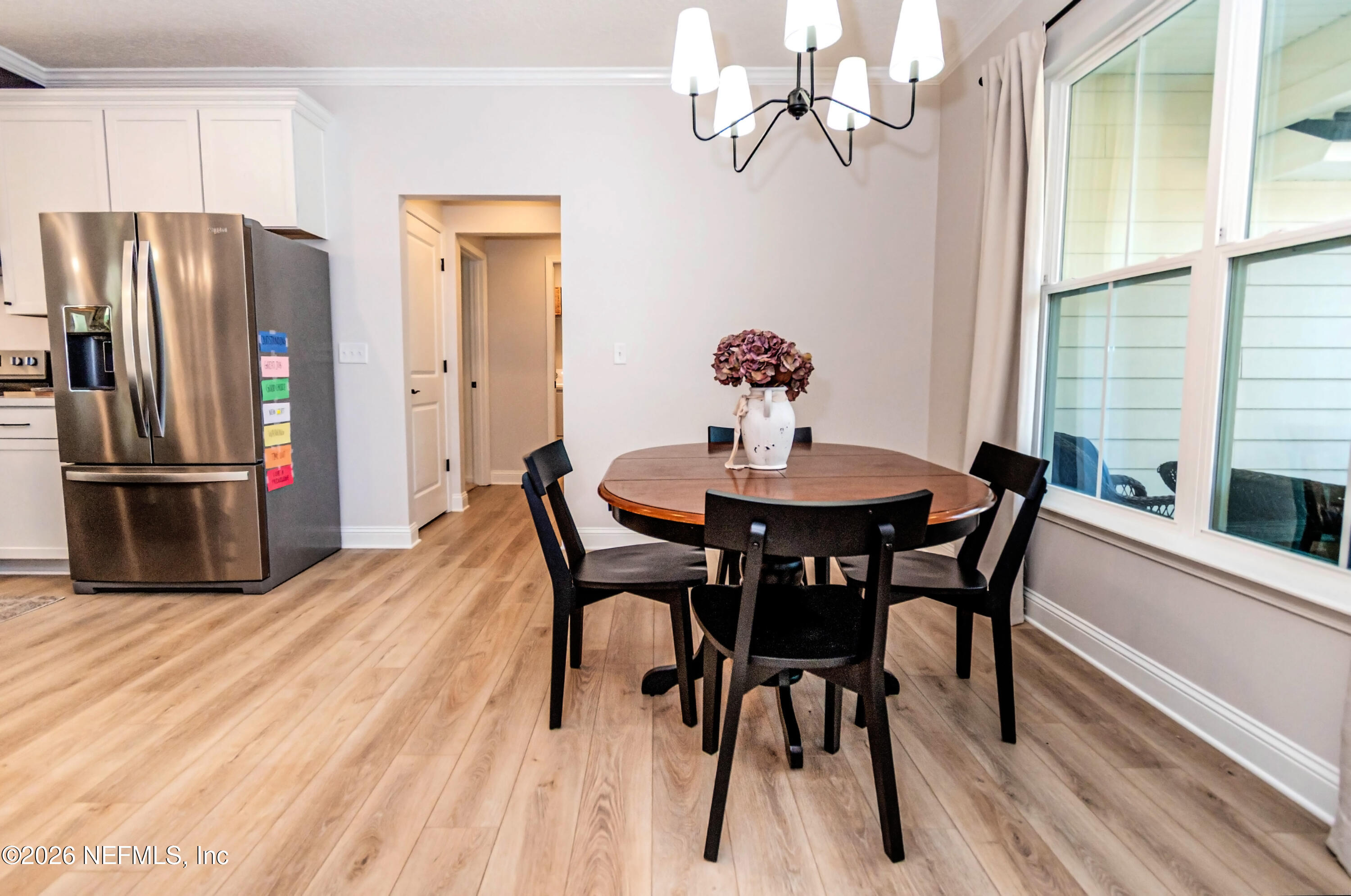 10800 Plummer Road Jacksonville, FL 32219 - Photo 4 of 67 a view of a dining room with furniture and a chandelier