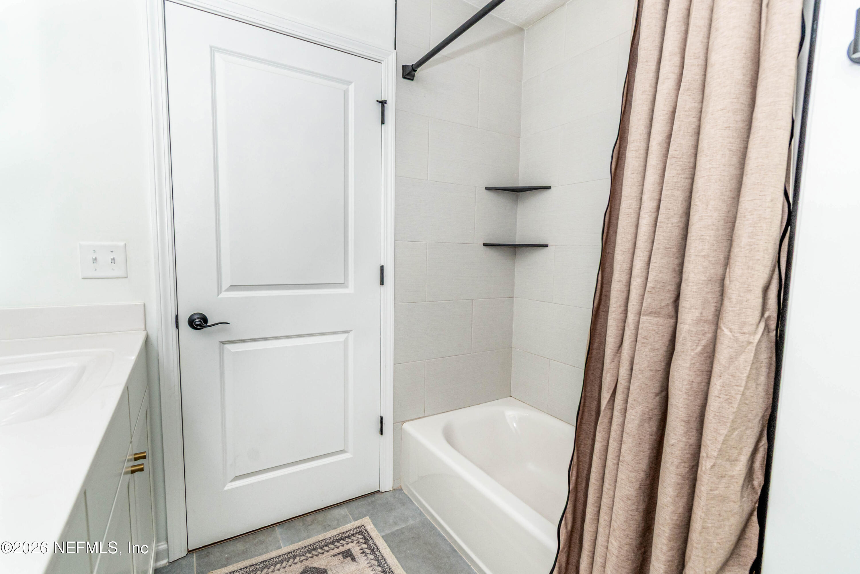 10800 Plummer Road Jacksonville, FL 32219 - Photo 43 of 67 a bathroom with a bathtub and a shower