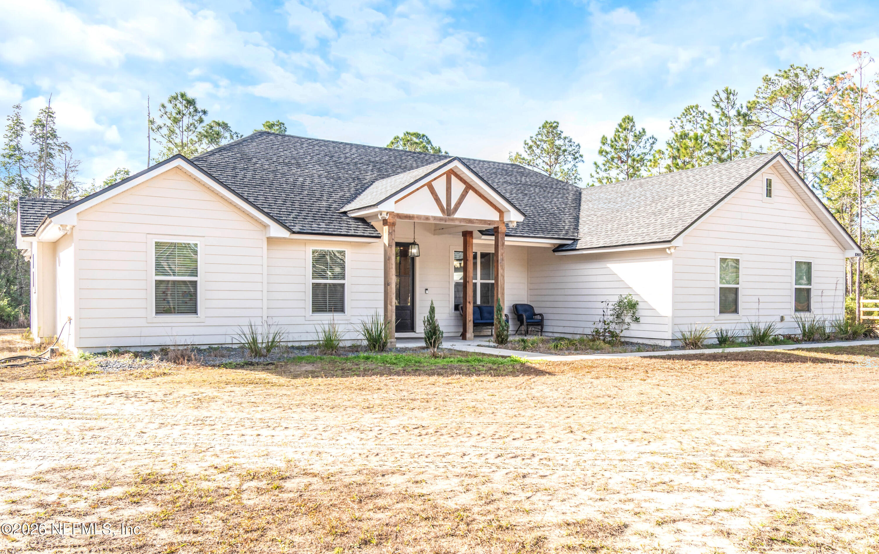10800 Plummer Road Jacksonville, FL 32219 - Photo 55 of 67 a front view of a house with a yard