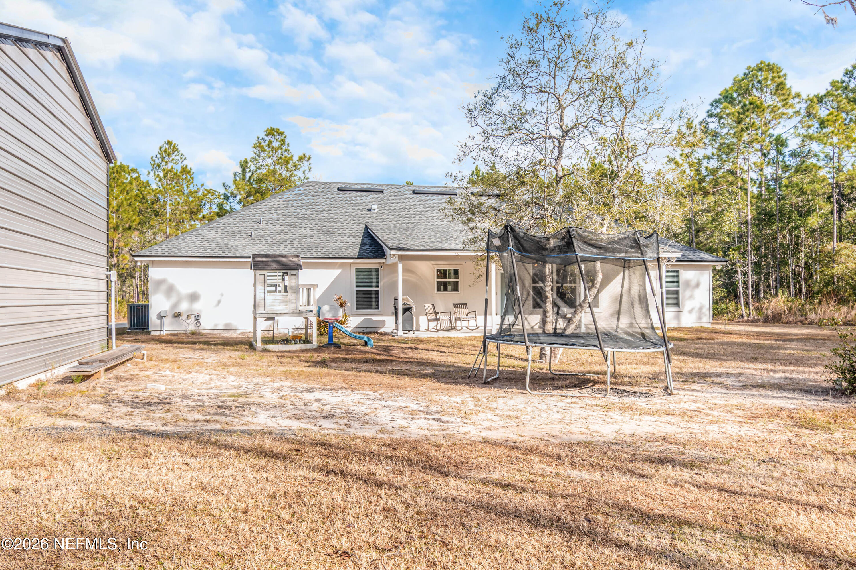 10800 Plummer Road Jacksonville, FL 32219 - Photo 59 of 67 a house view with a backyard space