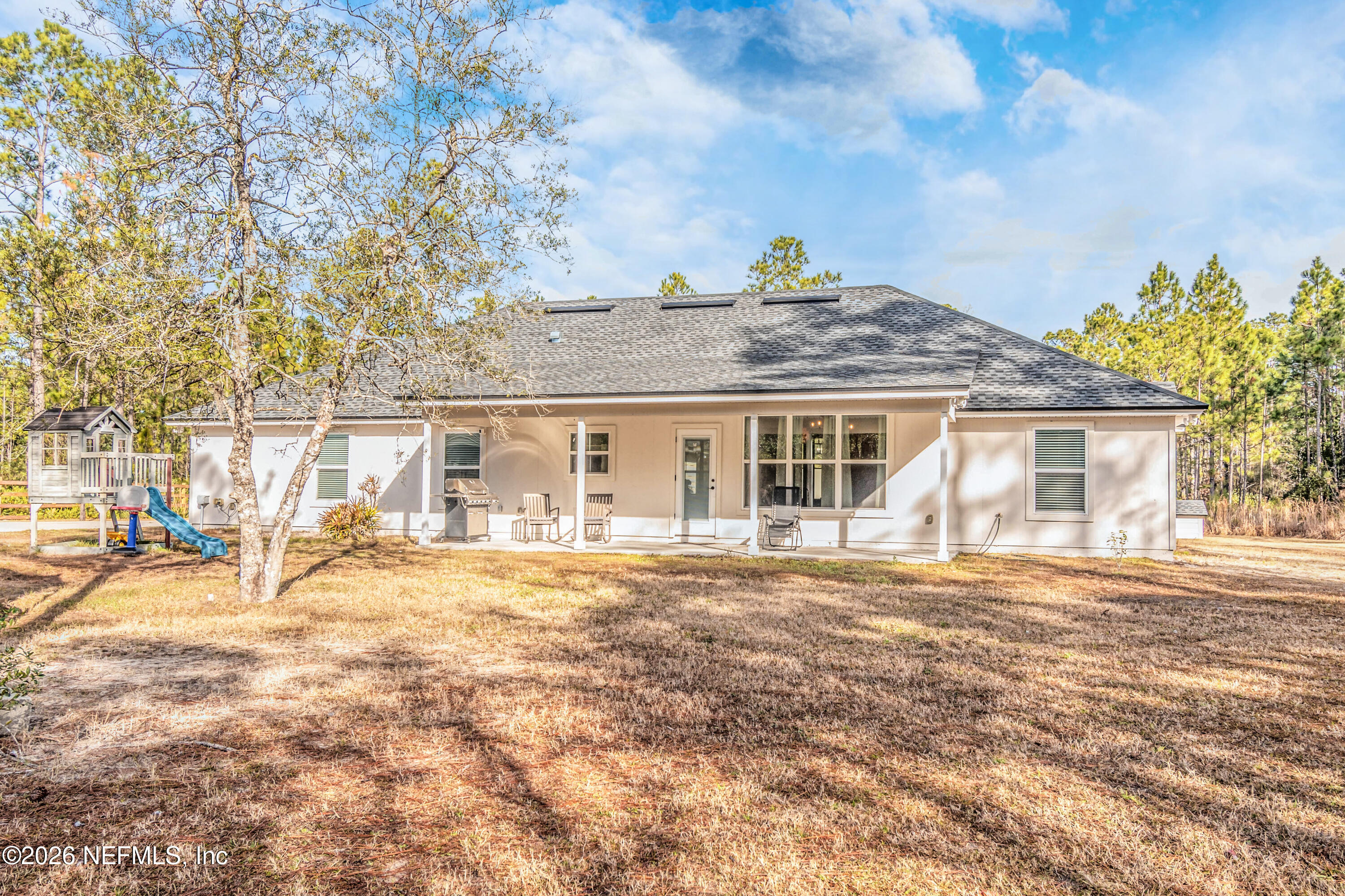 10800 Plummer Road Jacksonville, FL 32219 - Photo 60 of 67 a view of a yard in front of a house