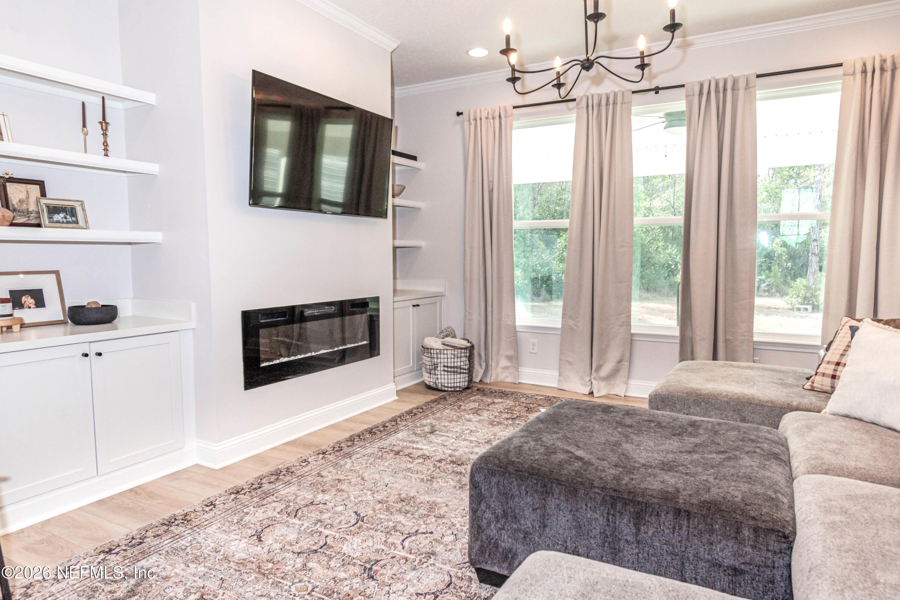 10800 Plummer Road Jacksonville, FL 32219 - Photo 6 of 67 a spacious bedroom with a bed and a television