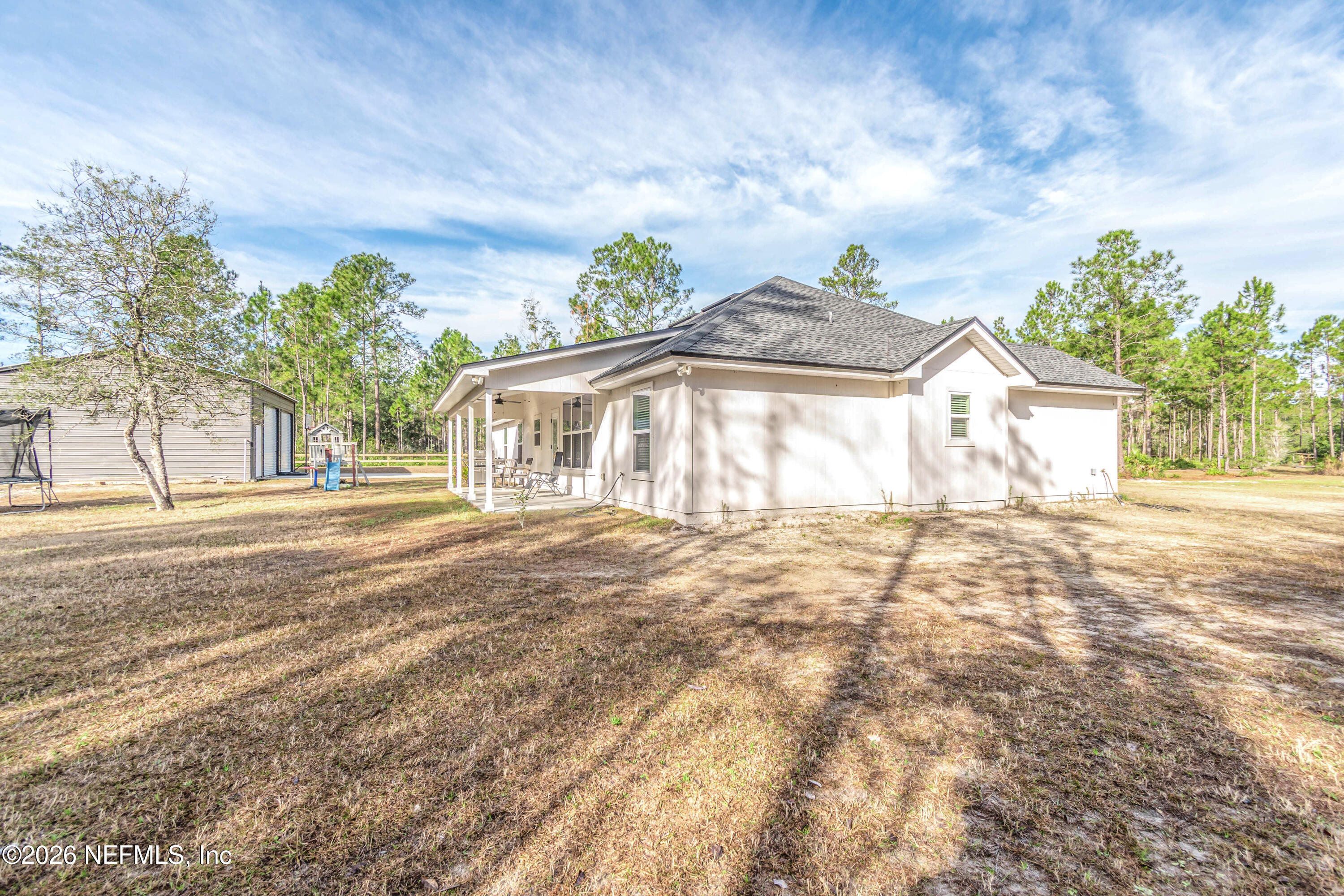 10800 Plummer Road Jacksonville, FL 32219 - Photo 61 of 67 a front view of a house with a garden