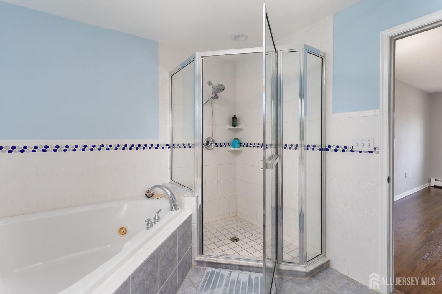 7 High Point Road East Brunswick, NJ 08816 - Photo 34 of 54 a bathroom with a bathtub and a shower