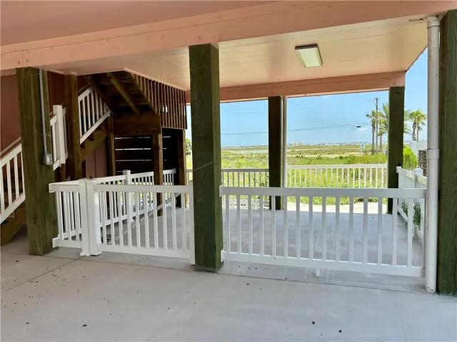 a view of stairs and a yard