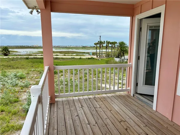 a view of balcony with floor to ceiling window with wooden floor