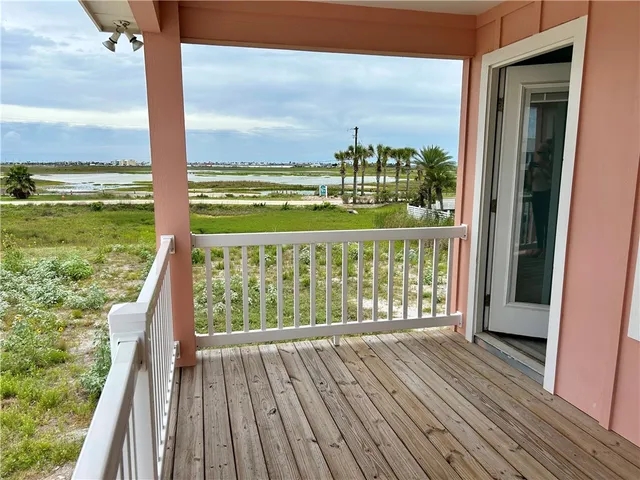 a view of balcony with floor to ceiling window with wooden floor