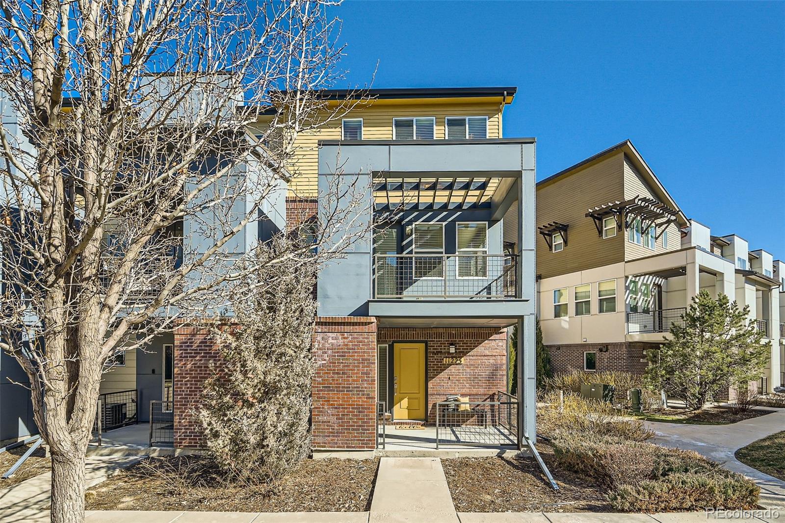 a front view of a building with large windows