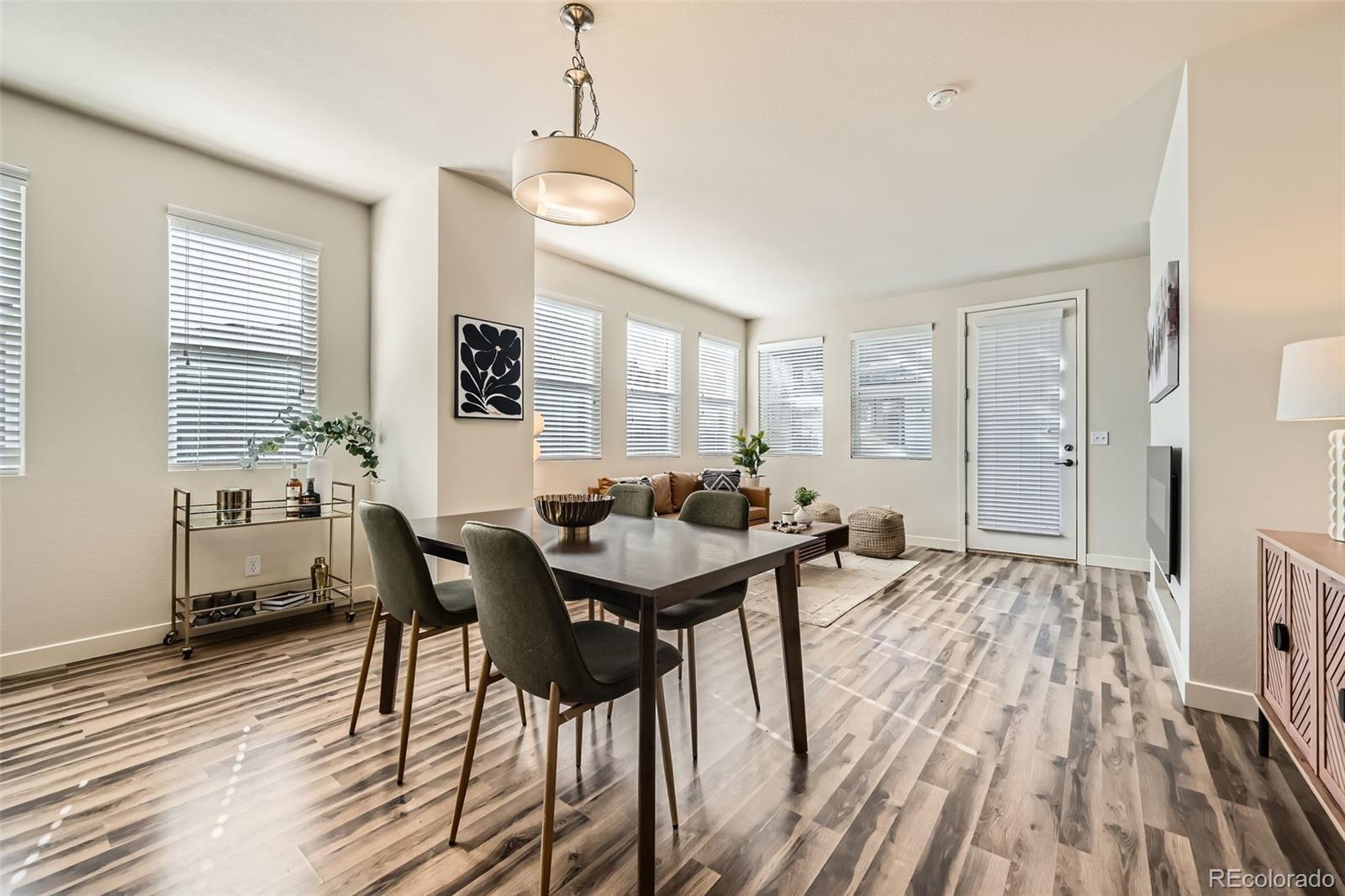 11225 Colony Circle Broomfield, CO 80021 - Photo 11 of 25 a view of a dining room with furniture and wooden floor