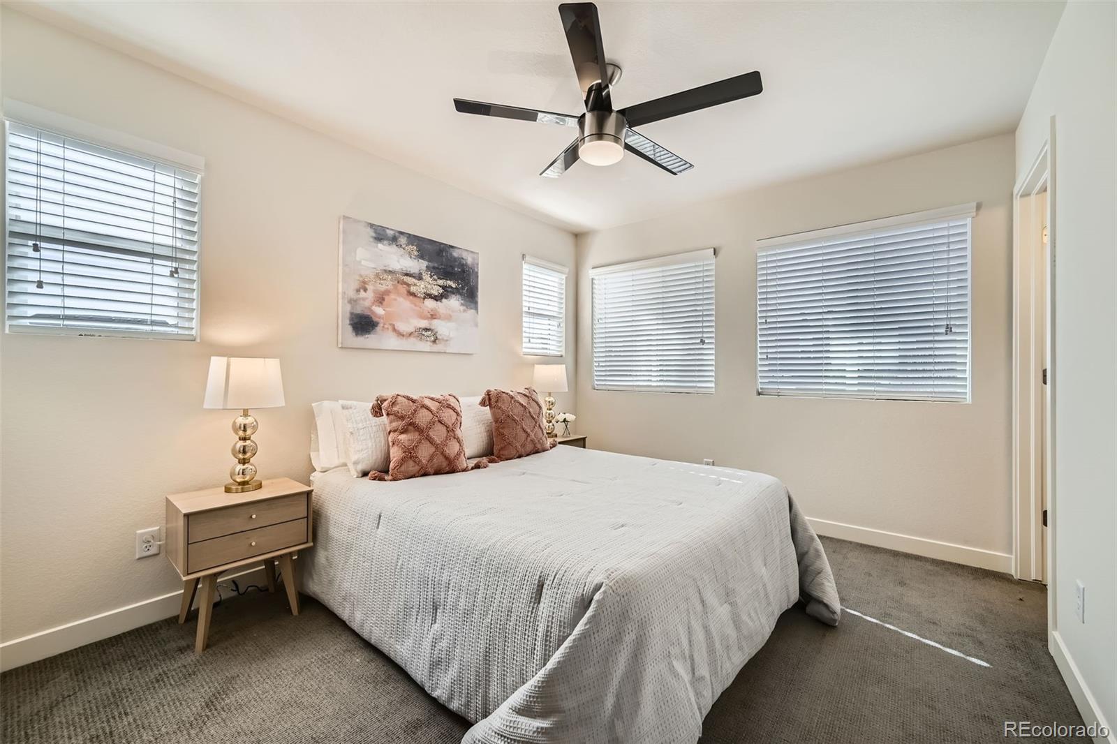 11225 Colony Circle Broomfield, CO 80021 - Photo 12 of 25 a bedroom with a bed and a window