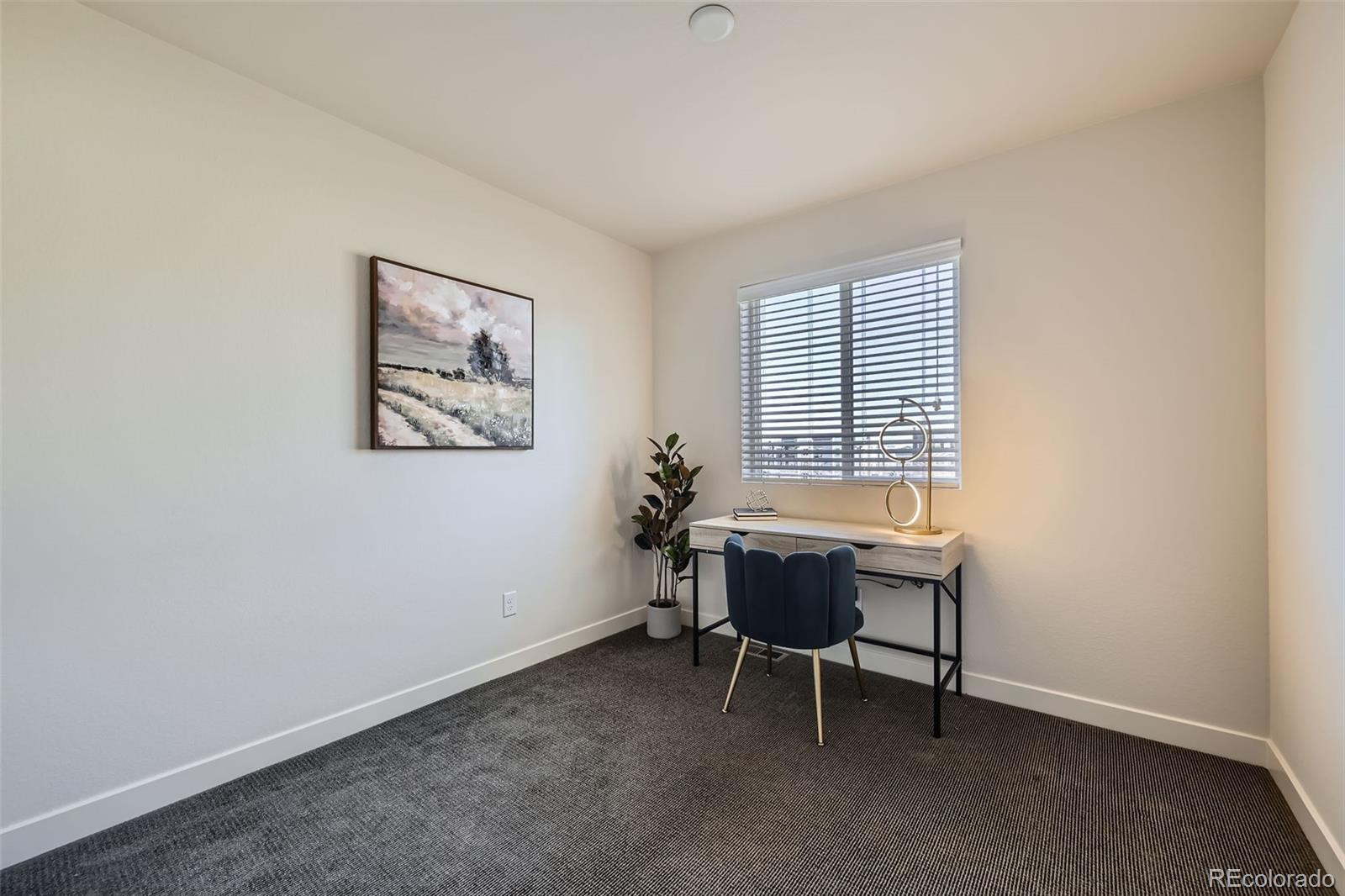 11225 Colony Circle Broomfield, CO 80021 - Photo 16 of 25 a workspace with furniture and a window