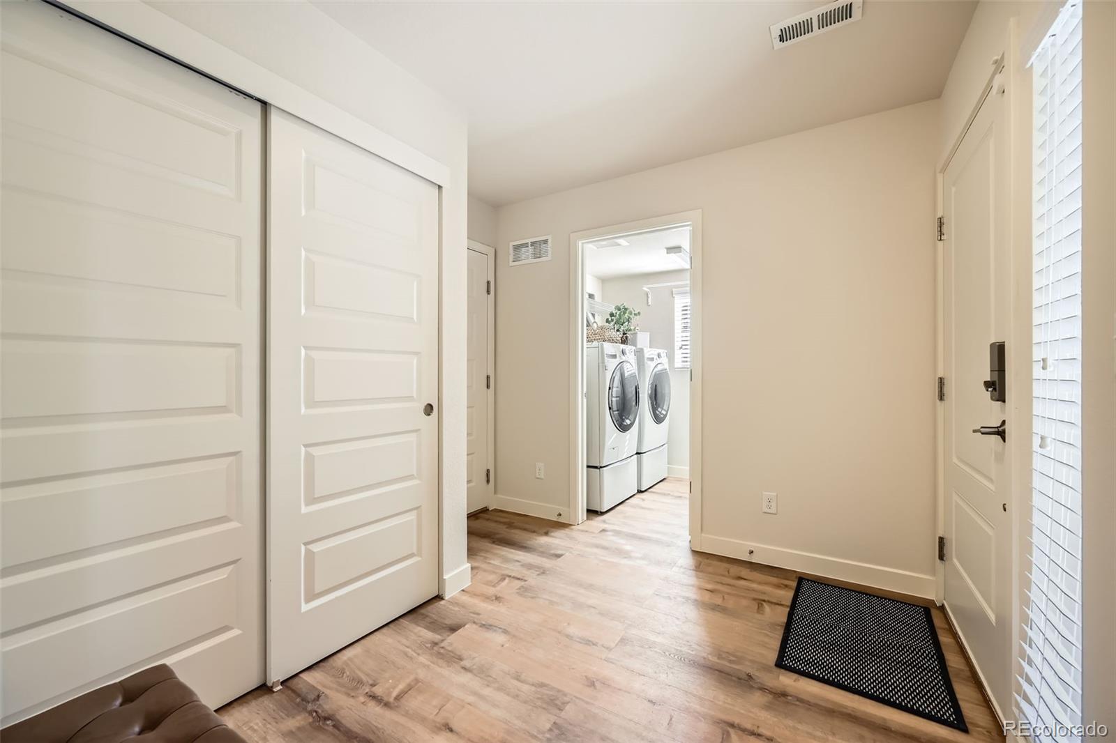 11225 Colony Circle Broomfield, CO 80021 - Photo 25 of 25 an empty room with wooden floor and windows