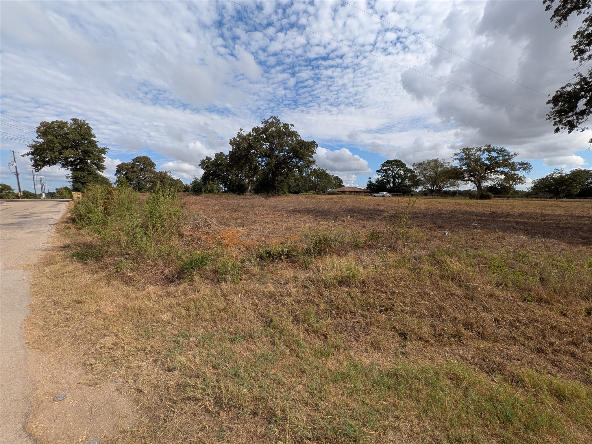 1262 FM 112 Road Lexington, TX 78947 - Photo 4 of 11 a view of a houses with yard and ocean view