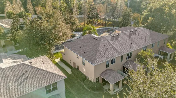 a aerial view of a house with a yard