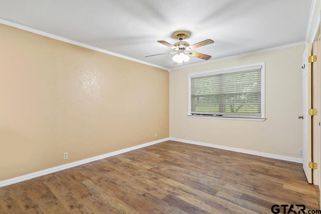 448 North Hill Road Tyler, TX 75706 - Photo 20 of 30 a view of an empty room with window and wooden floor