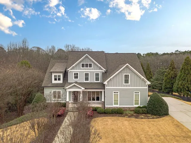 a view of a house with a snow in the yard