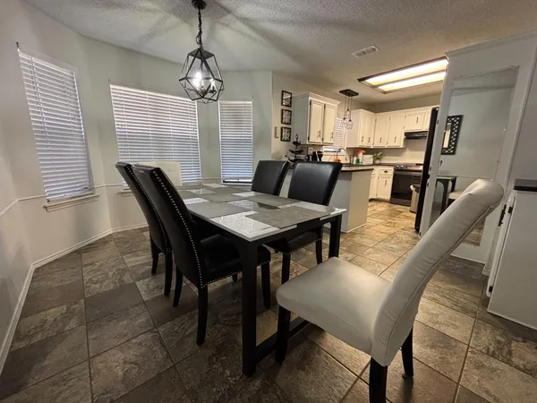 a view of a dining room with furniture