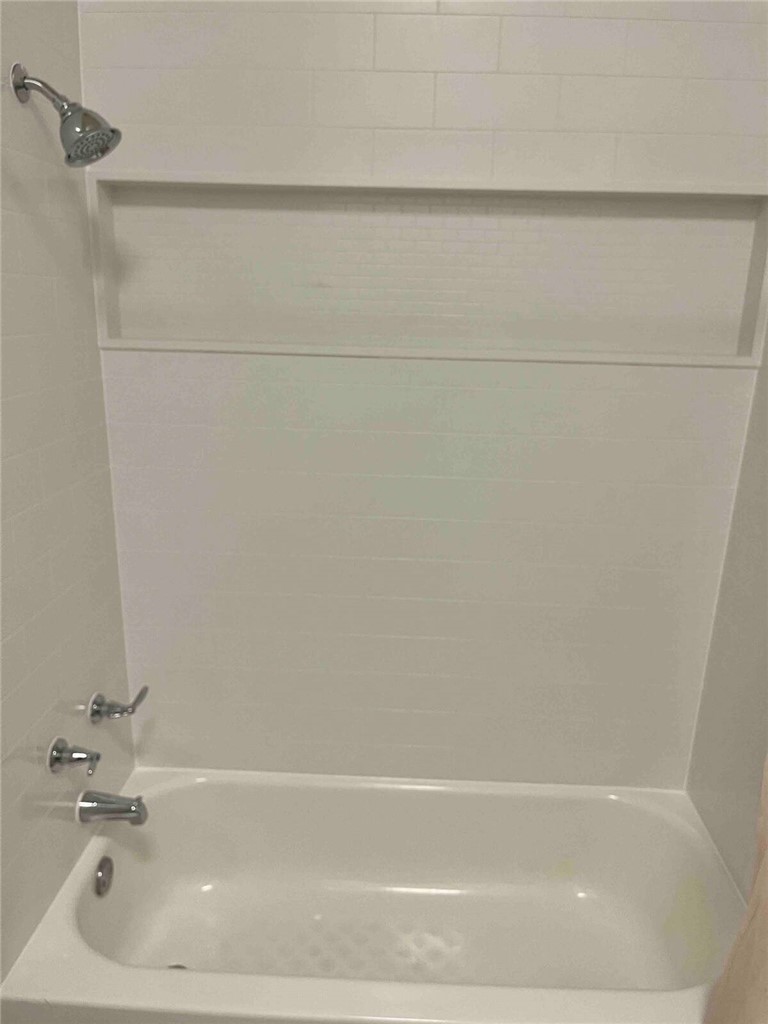 2580 5th Street Ingleside, TX 78362 - Photo 25 of 28 a bathroom with a bathtub
