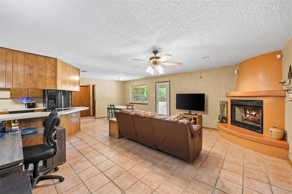 505 Curtis Road Burleson, TX 76028 - Photo 16 of 19 a living room with furniture and a flat screen tv