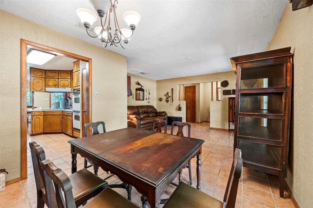 505 Curtis Road Burleson, TX 76028 - Photo 19 of 19 a view of a dining room with furniture window and wooden floor