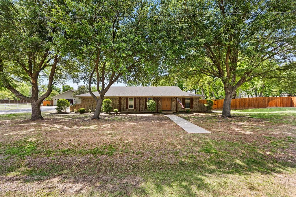 505 Curtis Road Burleson, TX 76028 - Photo 2 of 19 a view of a large trees with yard