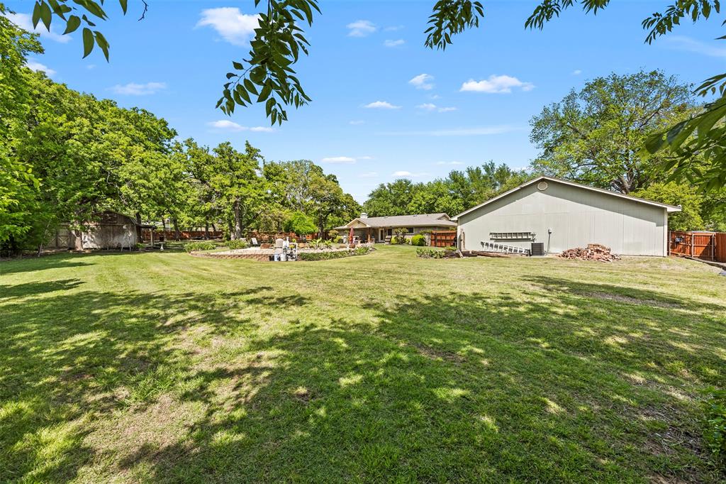 505 Curtis Road Burleson, TX 76028 - Photo 7 of 19 a view of a house with a yard