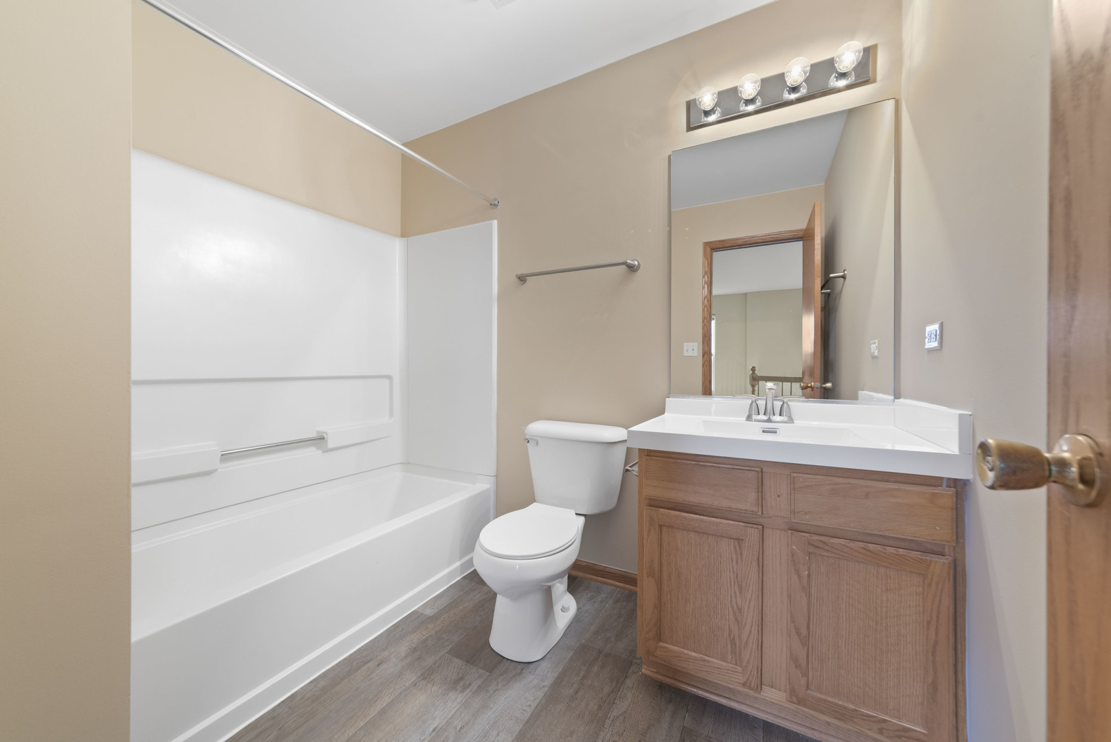 231 Springbrook Trail South Oswego, IL 60543 - Photo 15 of 17 a bathroom with a sink toilet a mirror and shower