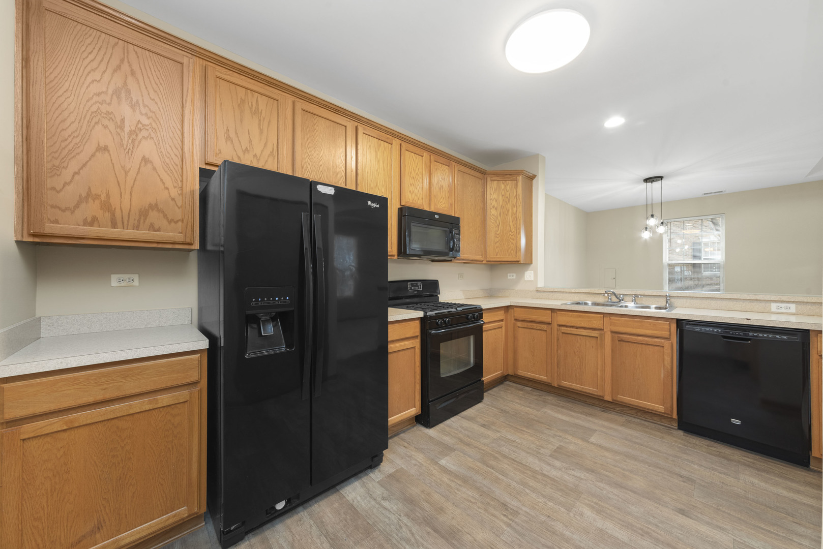 231 Springbrook Trail South Oswego, IL 60543 - Photo 3 of 17 a kitchen with stainless steel appliances granite countertop a refrigerator stove top oven and sink