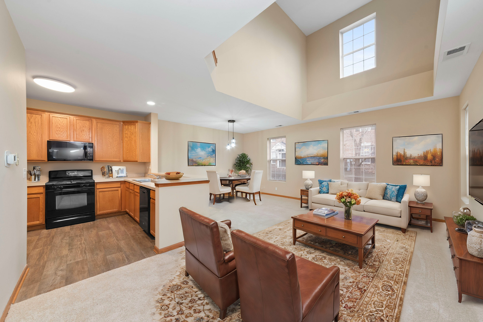 231 Springbrook Trail South Oswego, IL 60543 - Photo 5 of 17 a living room with fireplace furniture and a kitchen