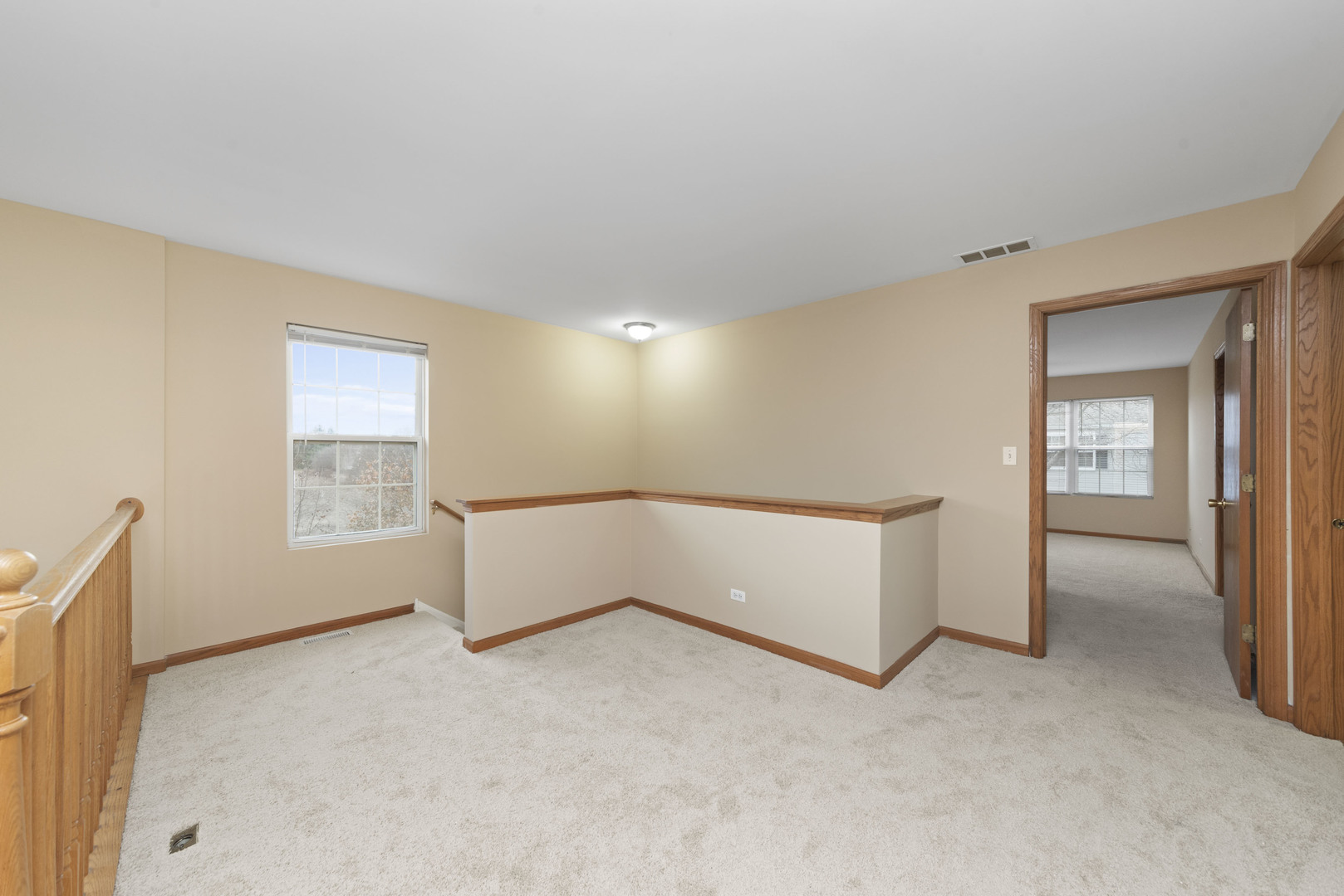 231 Springbrook Trail South Oswego, IL 60543 - Photo 9 of 17 a view of an empty room with a window