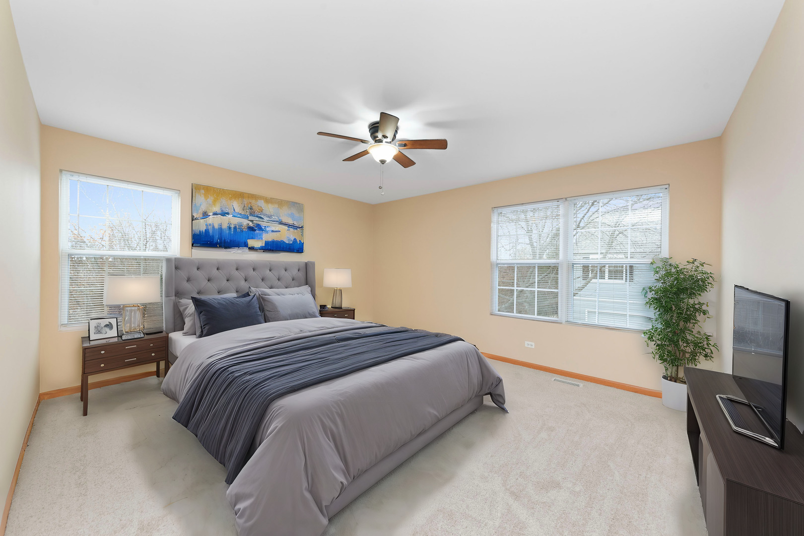 231 Springbrook Trail South Oswego, IL 60543 - Photo 10 of 17 a spacious bedroom with a bed and a chandelier