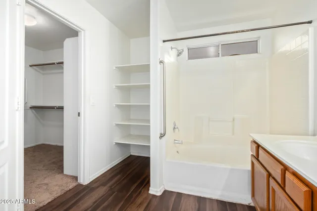 a bathroom with a bathtub and a shower