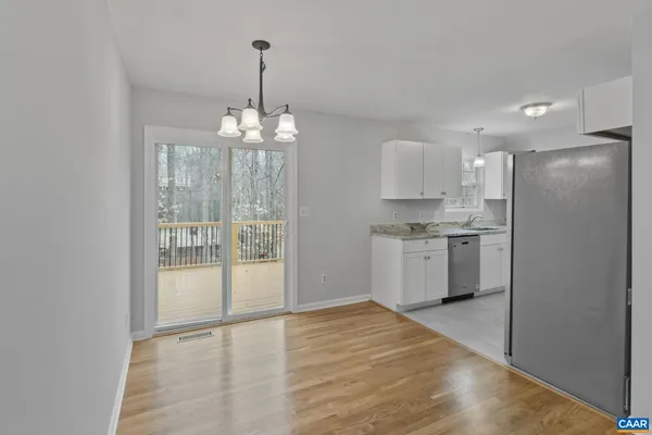 a view of an empty room with a ceiling fan