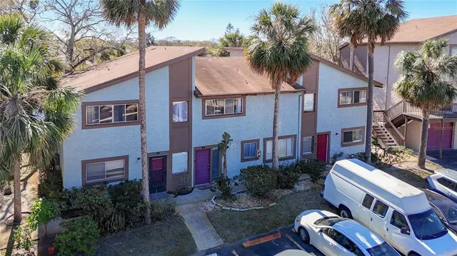a backyard of a house with outdoor seating
