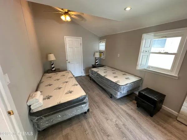 a bedroom with bed and a window