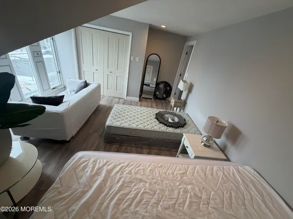 a bedroom with bed and window