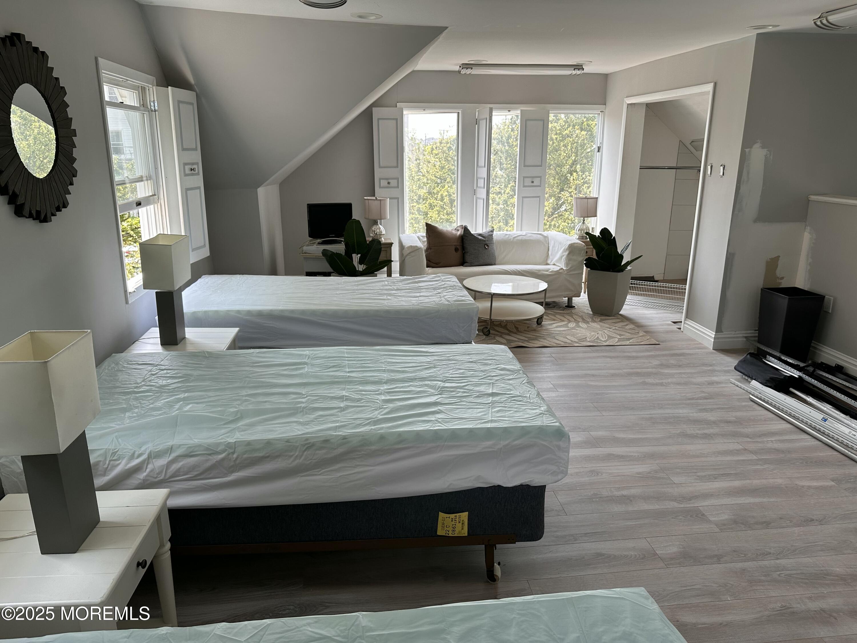 116 12th Avenue, Unit FRONT Belmar, NJ 07719 - Photo 5 of 7 a living room with furniture and a fireplace