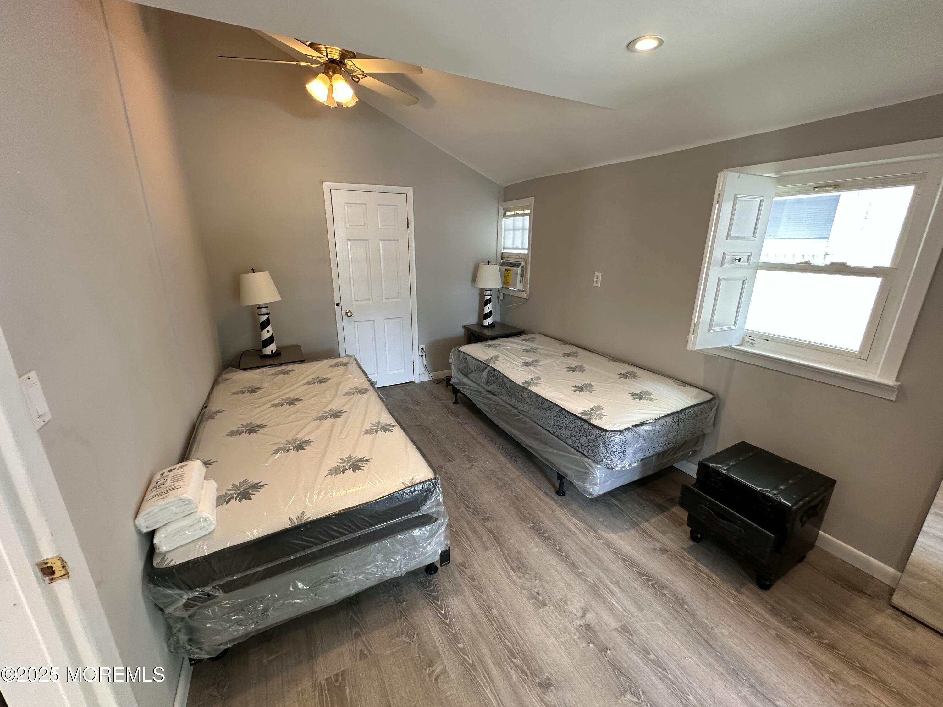 116 12th Avenue, Unit FRONT Belmar, NJ 07719 - Photo 6 of 7 a bedroom with bed and a window