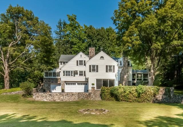 449 Ridgefield Road Wilton, CT 06897 - Photo 1 of 1 a front view of a house with a garden