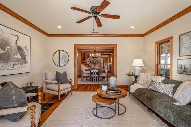 a kitchen with stainless steel appliances granite countertop wooden floors and wooden cabinets