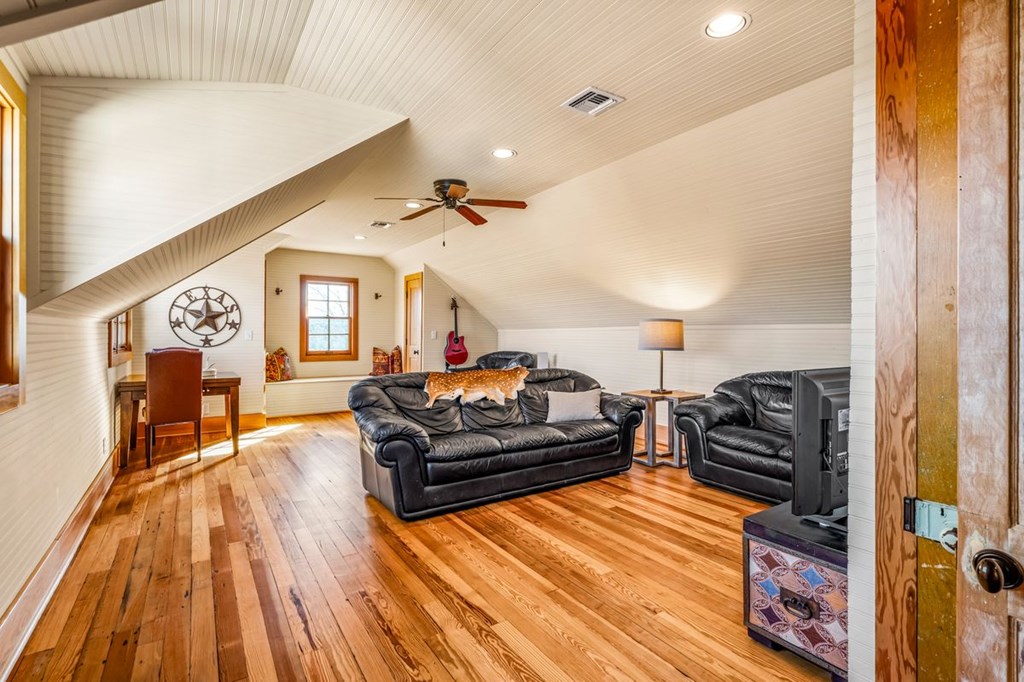 9402 Doss-Spring Creek Road Doss, TX 78618 - Photo 26 of 78 a living room with furniture and a wooden floor