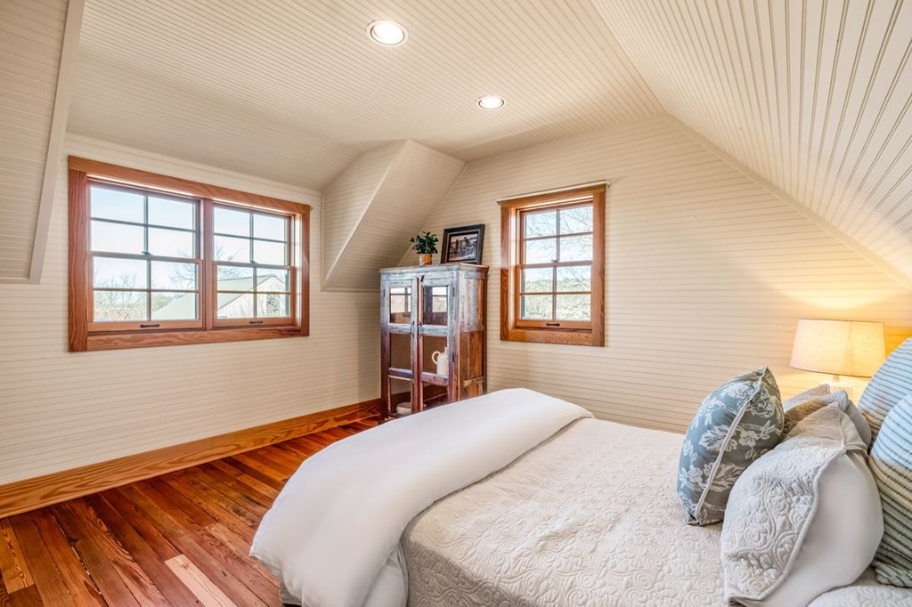 9402 Doss-Spring Creek Road Doss, TX 78618 - Photo 29 of 78 a bedroom with a bed and wooden floor