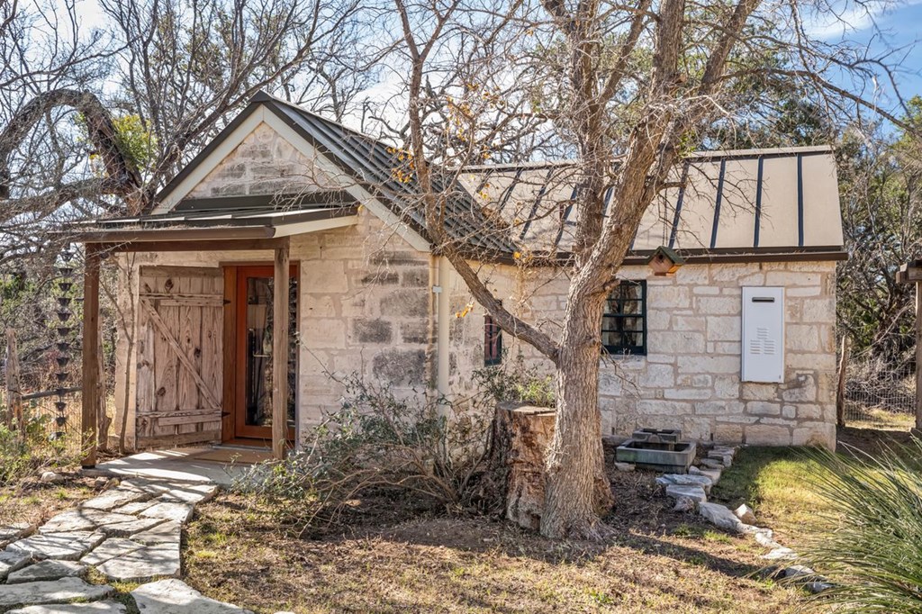 9402 Doss-Spring Creek Road Doss, TX 78618 - Photo 41 of 78 a front view of a house with a yard