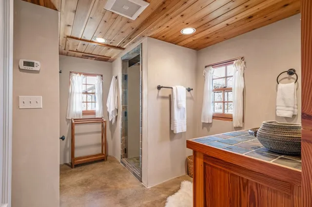 a view of a lake with houses in the back