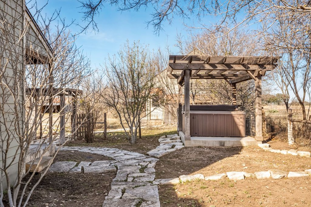 9402 Doss-Spring Creek Road Doss, TX 78618 - Photo 53 of 78 a view of a backyard with large trees
