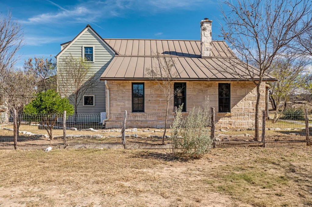 9402 Doss-Spring Creek Road Doss, TX 78618 - Photo 6 of 78 a front view of a house with garden