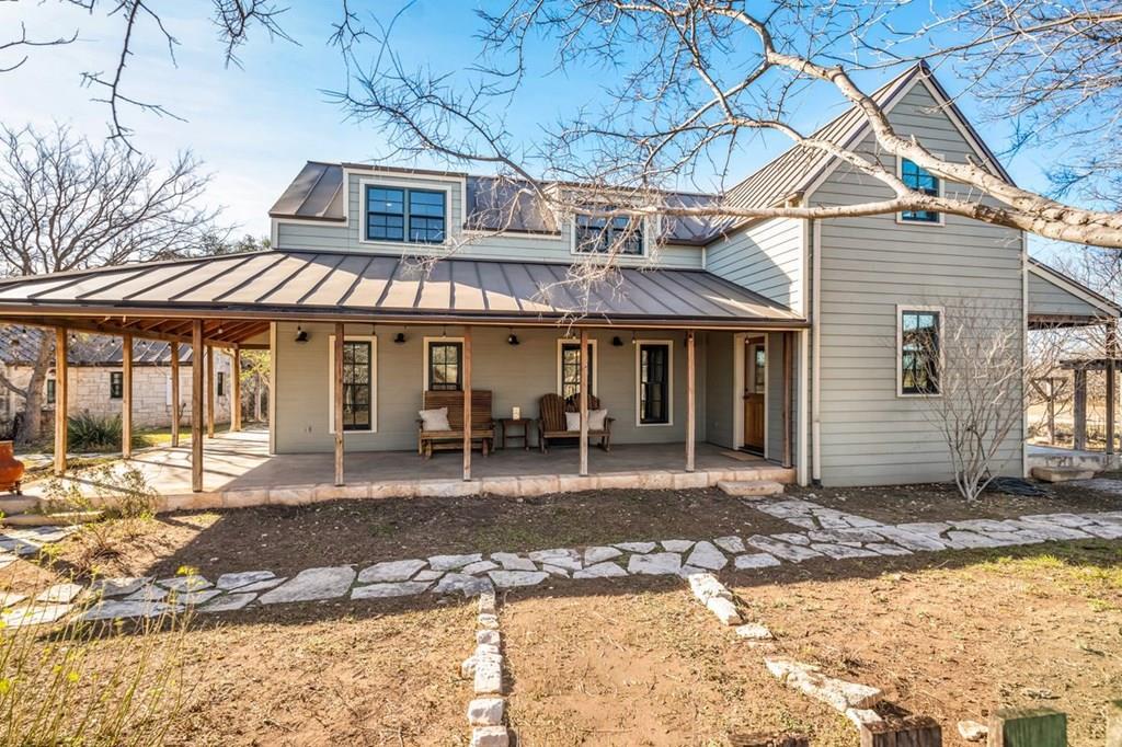 9402 Doss-Spring Creek Road Doss, TX 78618 - Photo 7 of 78 a front view of a house with a porch