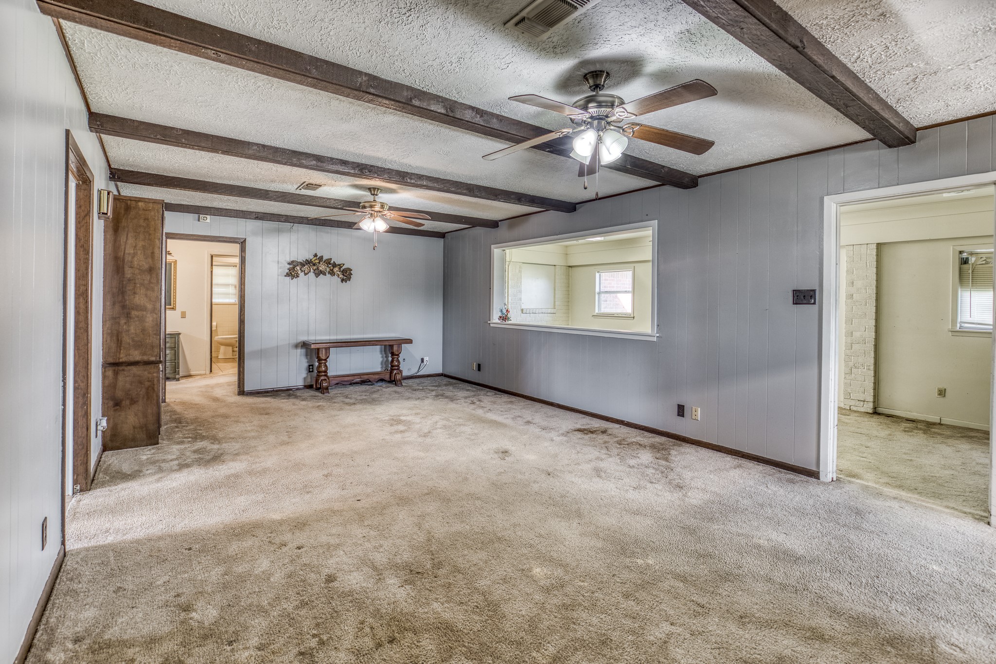 1687 Eagle Lake Road Sealy, TX 77474 - Photo 16 of 27 an empty room with chandelier fan and windows